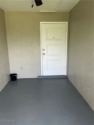 an empty room with a bench