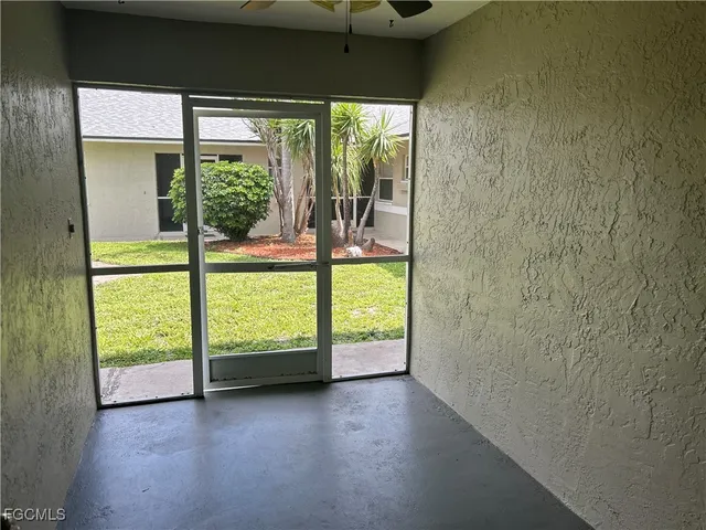 a view of an empty room and window