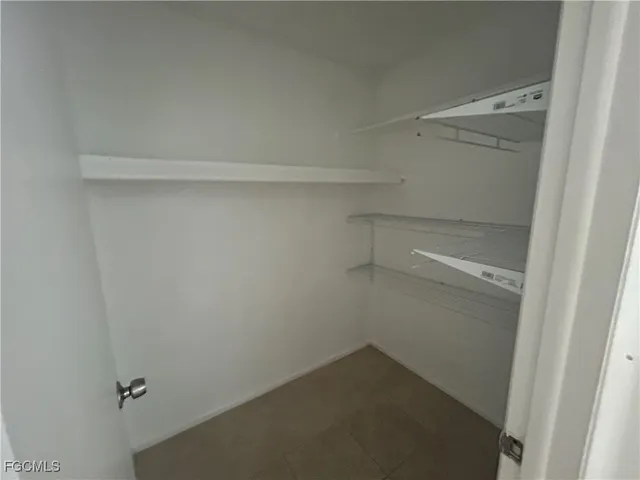 a view of an empty walk in closet