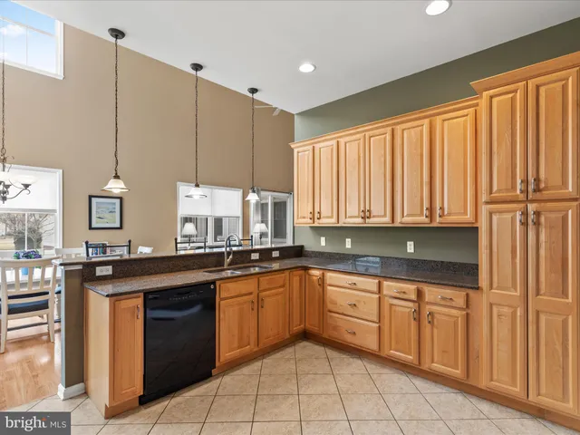 a living room with furniture and a table with wooden floor