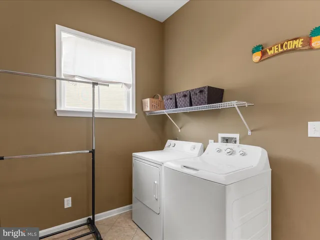 a living room with fireplace furniture and a flat screen tv