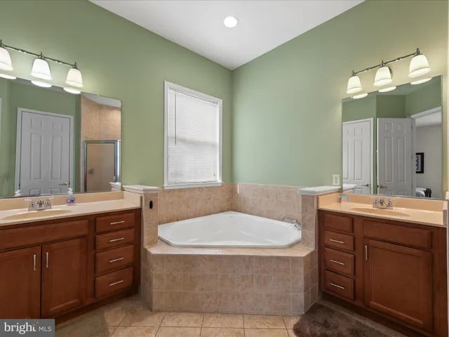 a kitchen with granite countertop a sink and a stove