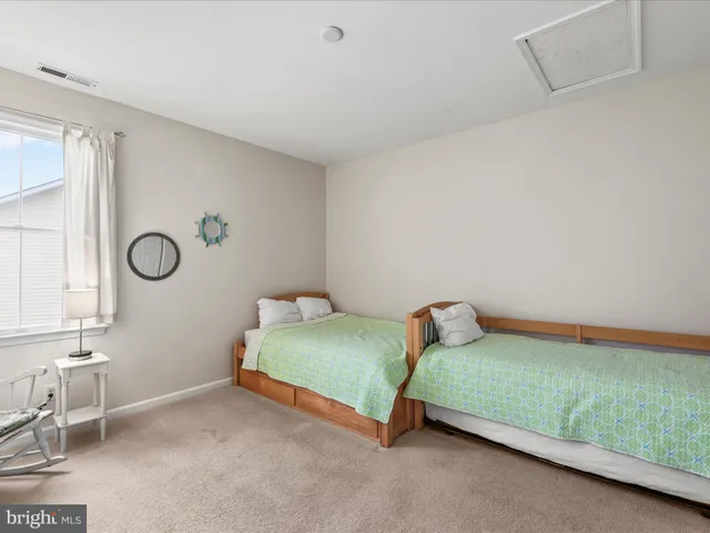 a bedroom with a bed and a table in it