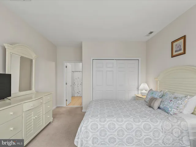 a bedroom with two beds and a window