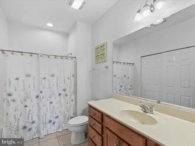a bedroom with two beds and painted walls