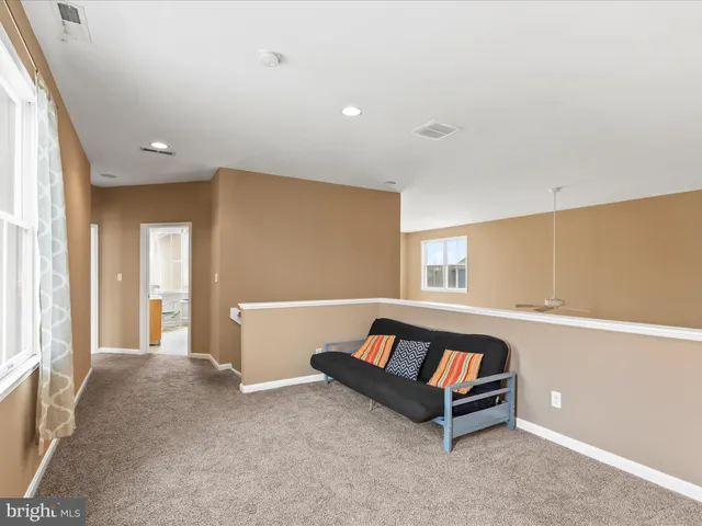 a bedroom with a bed and a dresser in it