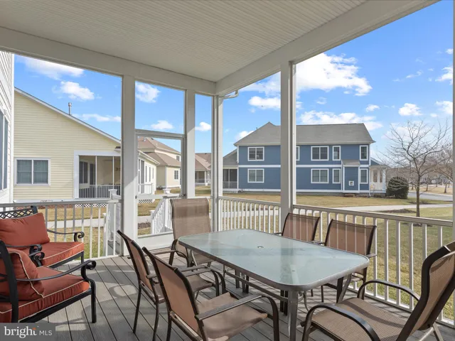 a spacious bedroom with a large bed and a flat tv screen
