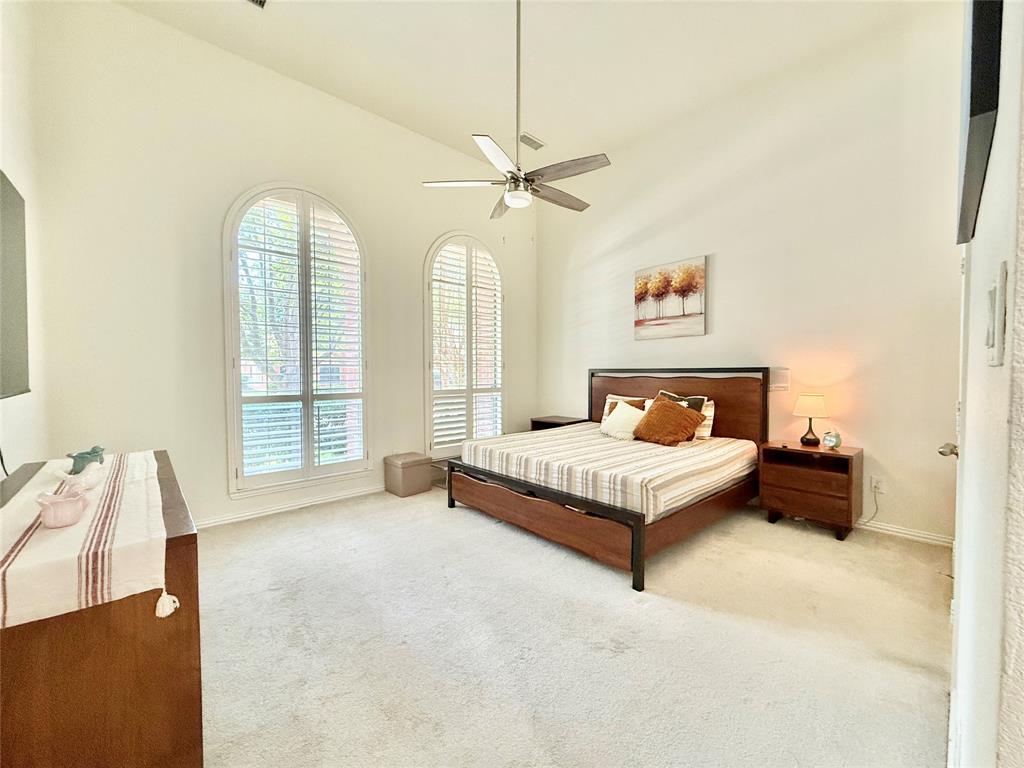 2754 Ridge View Road Frisco, TX 75034 - Photo 14 of 34 a spacious bedroom with a bed and a large window