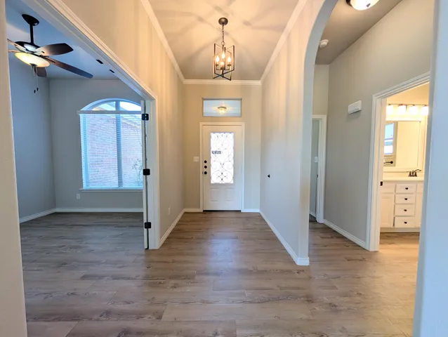 wooden floor in a hall with an entryway