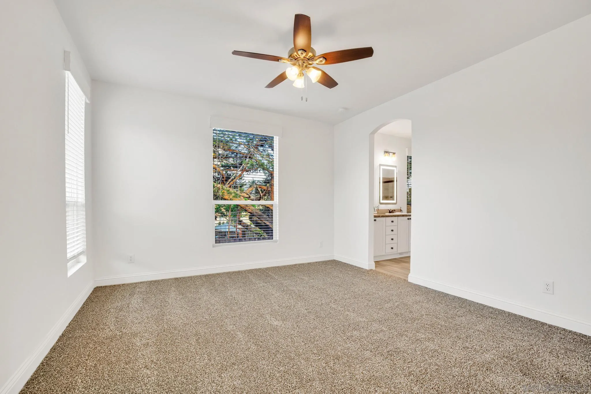 2515 Sweetwater Road, Unit 76 Spring Valley, CA 91977 - Photo 15 of 31 an empty room with windows and fan