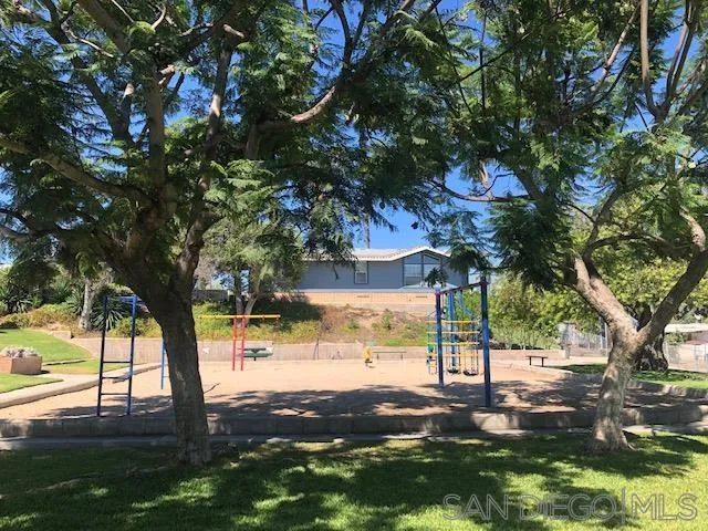 2515 Sweetwater Road, Unit 76 Spring Valley, CA 91977 - Photo 28 of 31 a view of a trees and yard