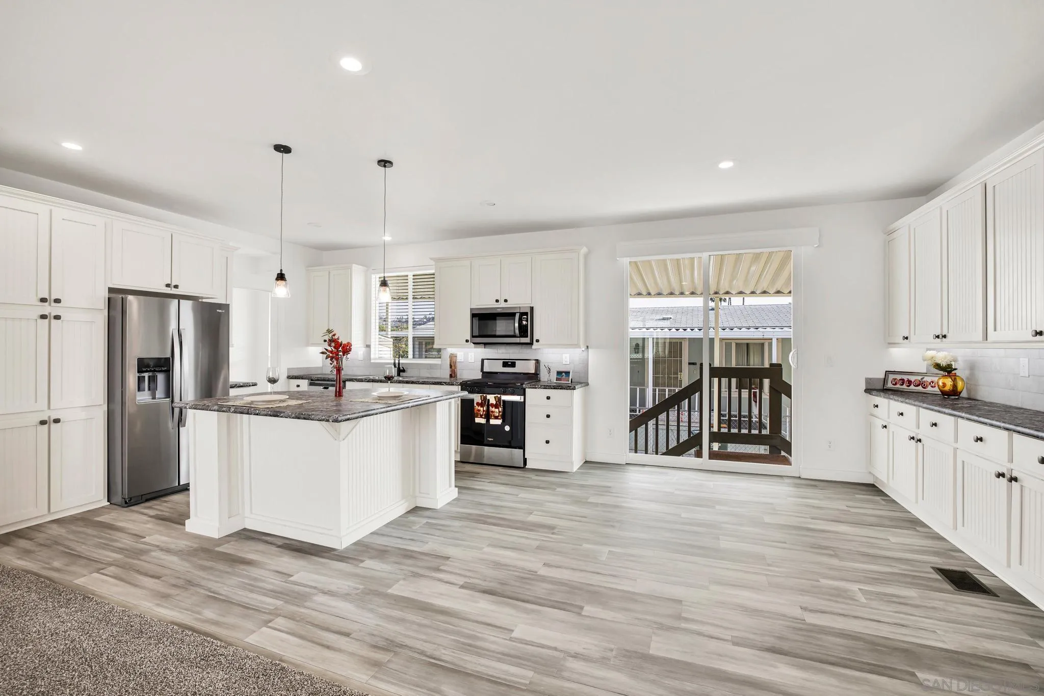 2515 Sweetwater Road, Unit 76 Spring Valley, CA 91977 - Photo 4 of 31 a kitchen with refrigerator and cabinets