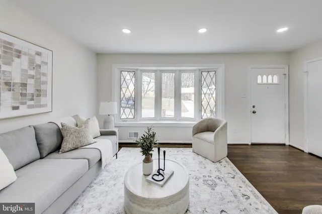 a living room with furniture and window