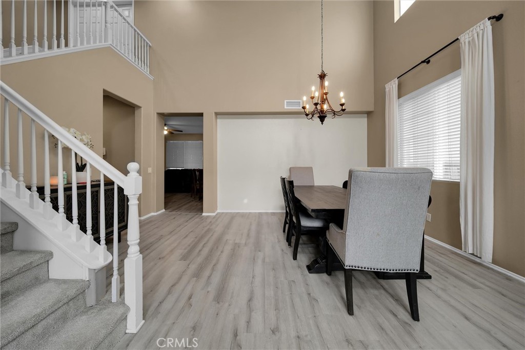 28440 Ware Street Murrieta, CA 92563 - Photo 13 of 72 a view of a dining room with furniture window and wooden floor
