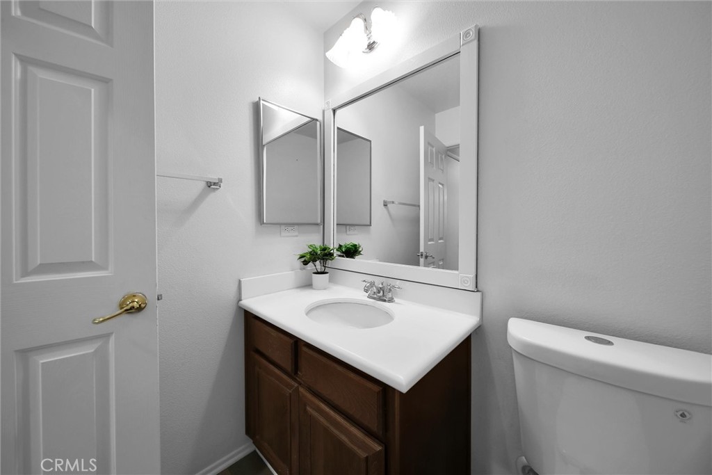 28440 Ware Street Murrieta, CA 92563 - Photo 14 of 72 a bathroom with a sink toilet and vanity