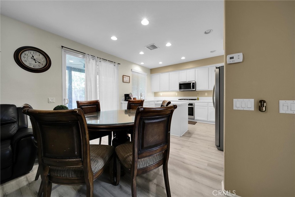 28440 Ware Street Murrieta, CA 92563 - Photo 16 of 72 a view of a dining room with furniture and window