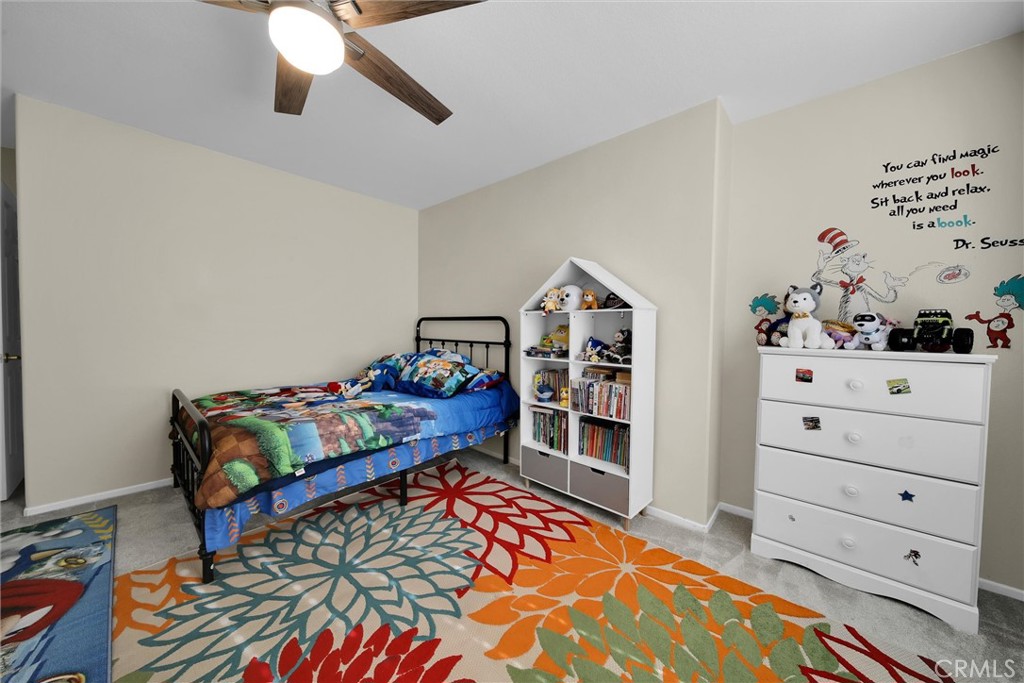 28440 Ware Street Murrieta, CA 92563 - Photo 26 of 72 a bedroom with a bed and cabinet