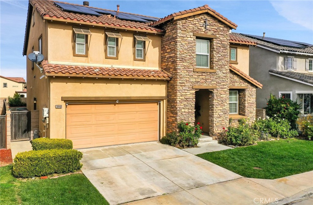 28440 Ware Street Murrieta, CA 92563 - Photo 3 of 72 a front view of a house with garden