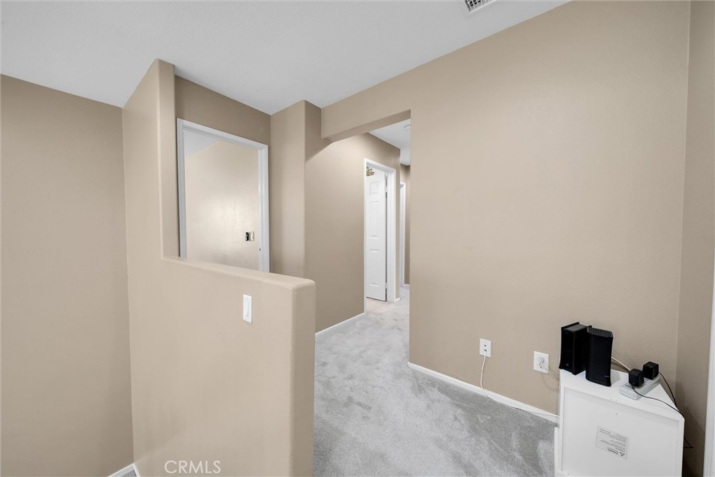 28440 Ware Street Murrieta, CA 92563 - Photo 32 of 72 Top of staircase facing hallway towards bedrooms from master bedroom doorway.