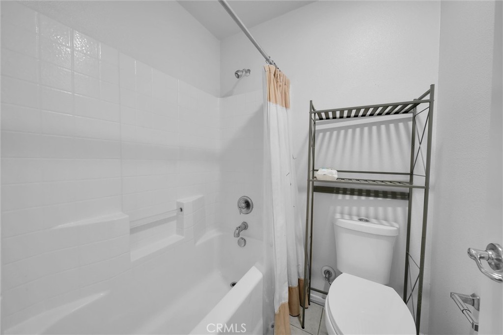 28440 Ware Street Murrieta, CA 92563 - Photo 34 of 72 a bathroom with a granite countertop toilet a sink and a bathtub