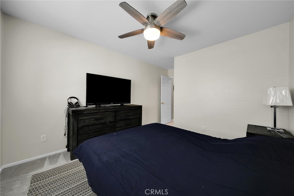 28440 Ware Street Murrieta, CA 92563 - Photo 41 of 72 a living room with a flat screen tv and a ceiling fan