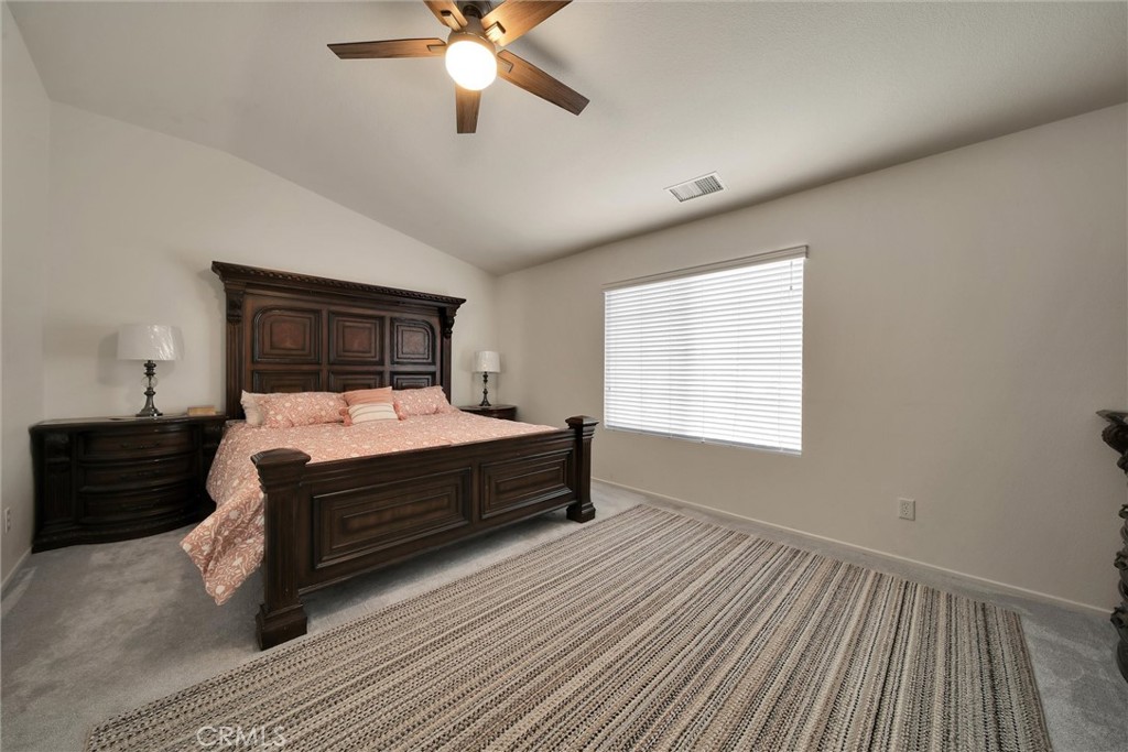 28440 Ware Street Murrieta, CA 92563 - Photo 45 of 72 a bedroom with a bed and wooden floor