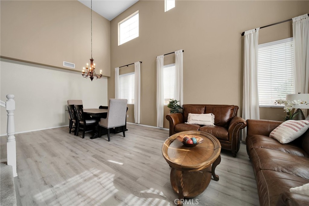28440 Ware Street Murrieta, CA 92563 - Photo 5 of 72 a living room with furniture and a chandelier