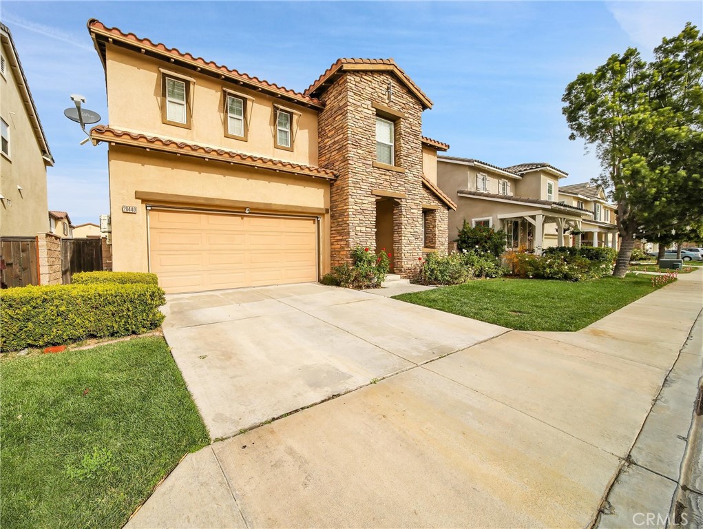 28440 Ware Street Murrieta, CA 92563 - Photo 72 of 72 a front view of a house with a garden