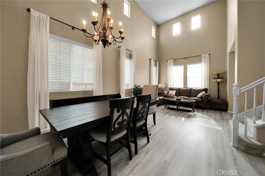 28440 Ware Street Murrieta, CA 92563 - Photo 8 of 72 a view of a dining room with furniture and a chandelier