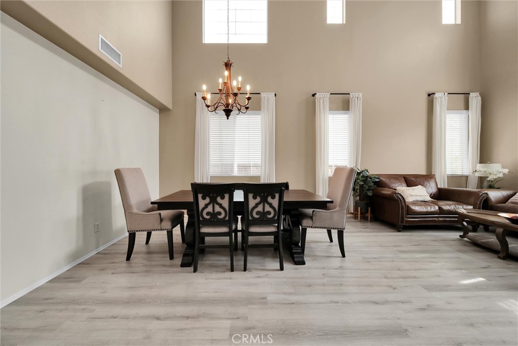 28440 Ware Street Murrieta, CA 92563 - Photo 9 of 72 a view of a dining room with furniture and wooden floor