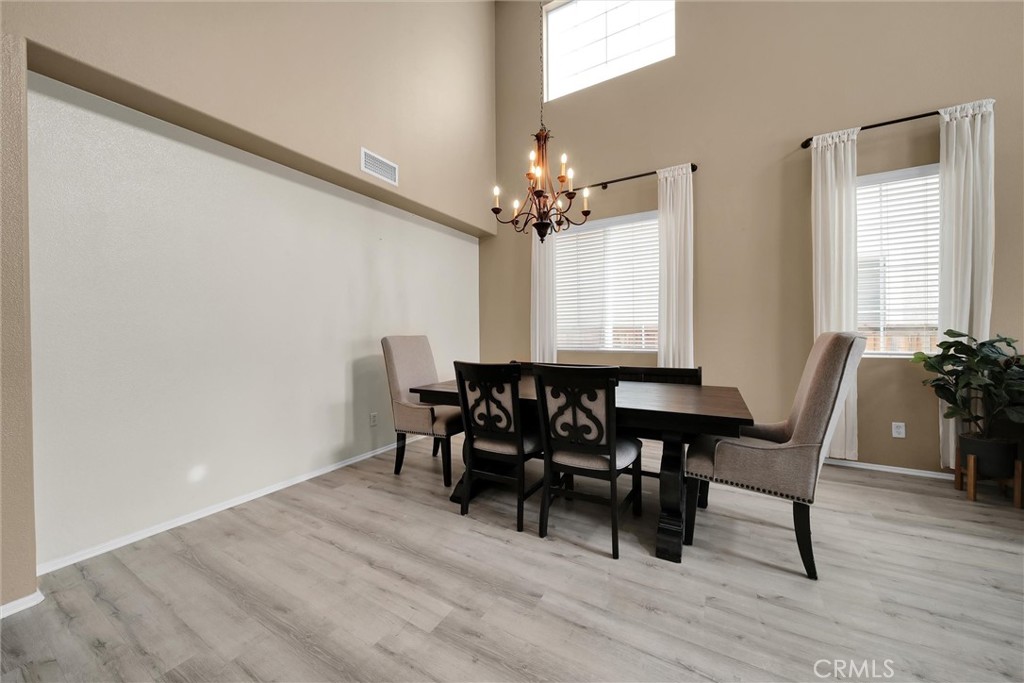 28440 Ware Street Murrieta, CA 92563 - Photo 10 of 72 a view of a dining room with furniture and window