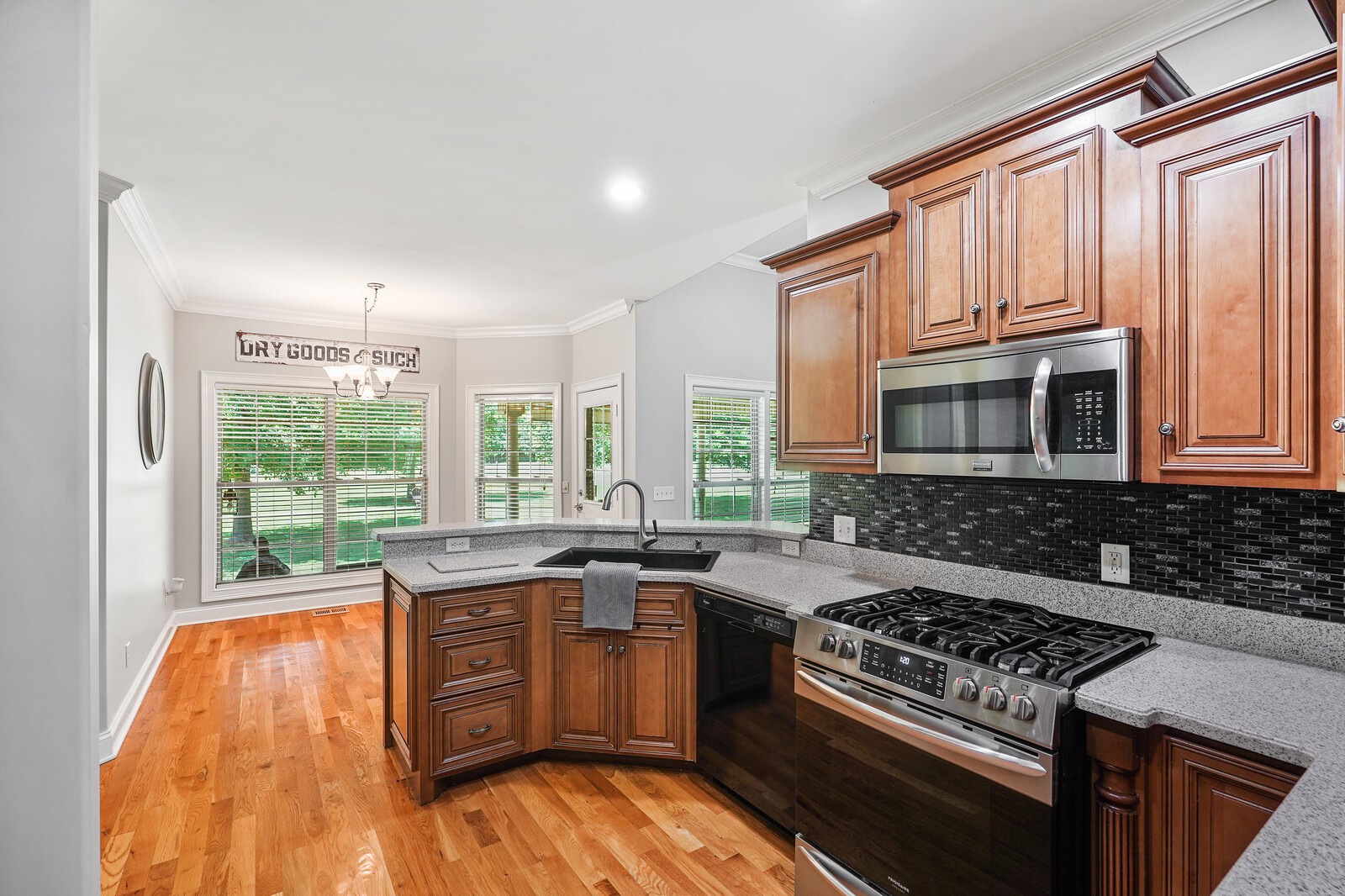 4221 Mt Zion Road Springfield, TN 37172 - Photo 24 of 36 a kitchen with stainless steel appliances granite countertop a stove a sink and a microwave