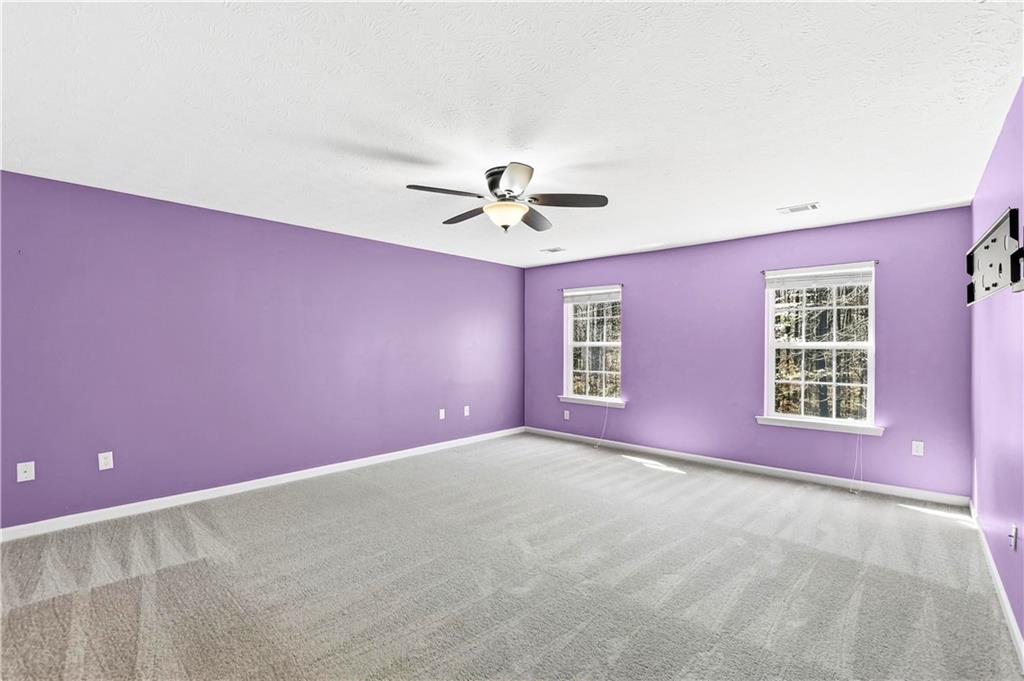 5976 Bowers Road Stone Mountain, GA 30087 - Photo 11 of 29 a view of a livingroom with a ceiling fan and window