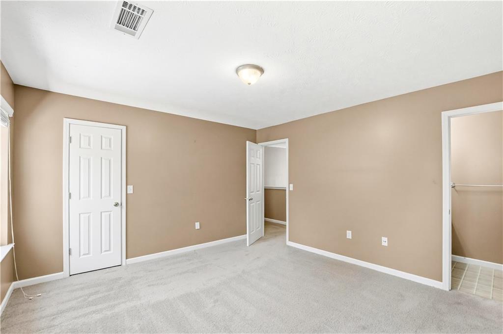 5976 Bowers Road Stone Mountain, GA 30087 - Photo 18 of 29 an empty room with closet area