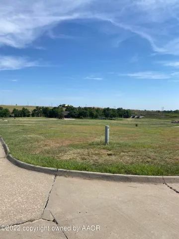a view of a lake with a big yard