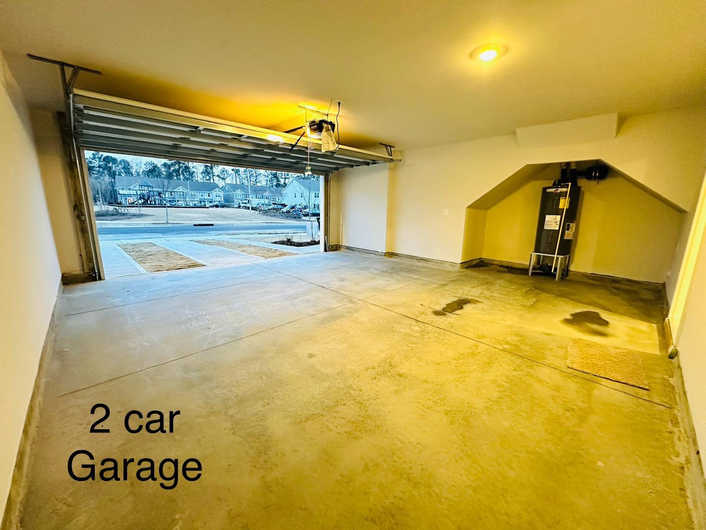 6931 Point Bar Place Raleigh, NC 27616 - Photo 12 of 13 a view of garage with a door