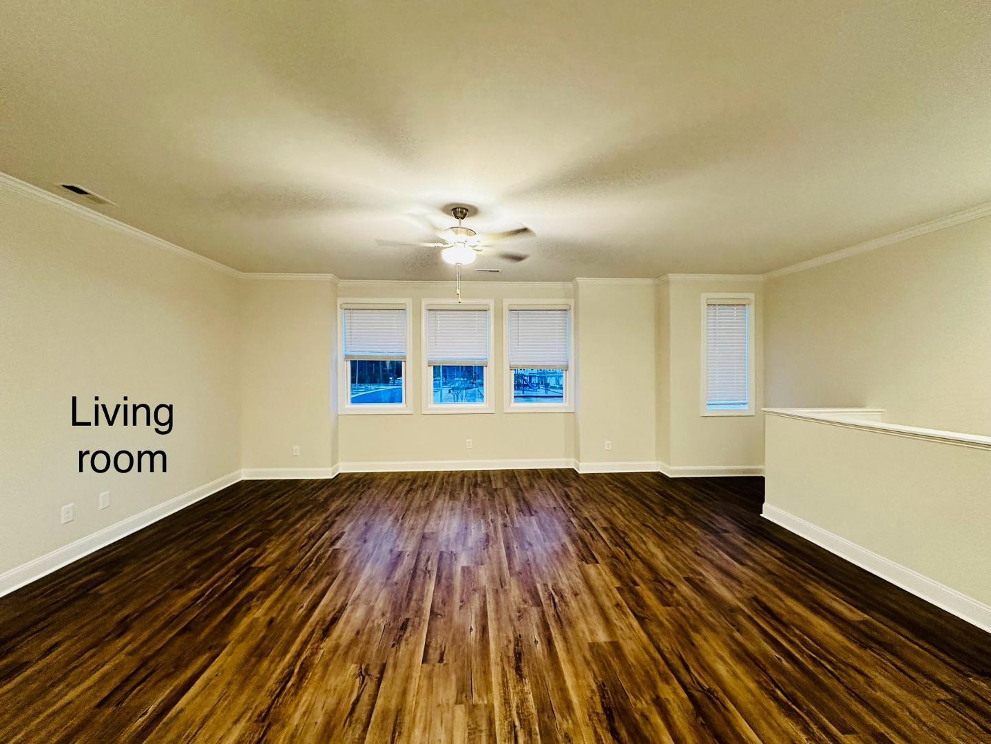 6931 Point Bar Place Raleigh, NC 27616 - Photo 3 of 13 a view of an empty room with wooden floor and a window
