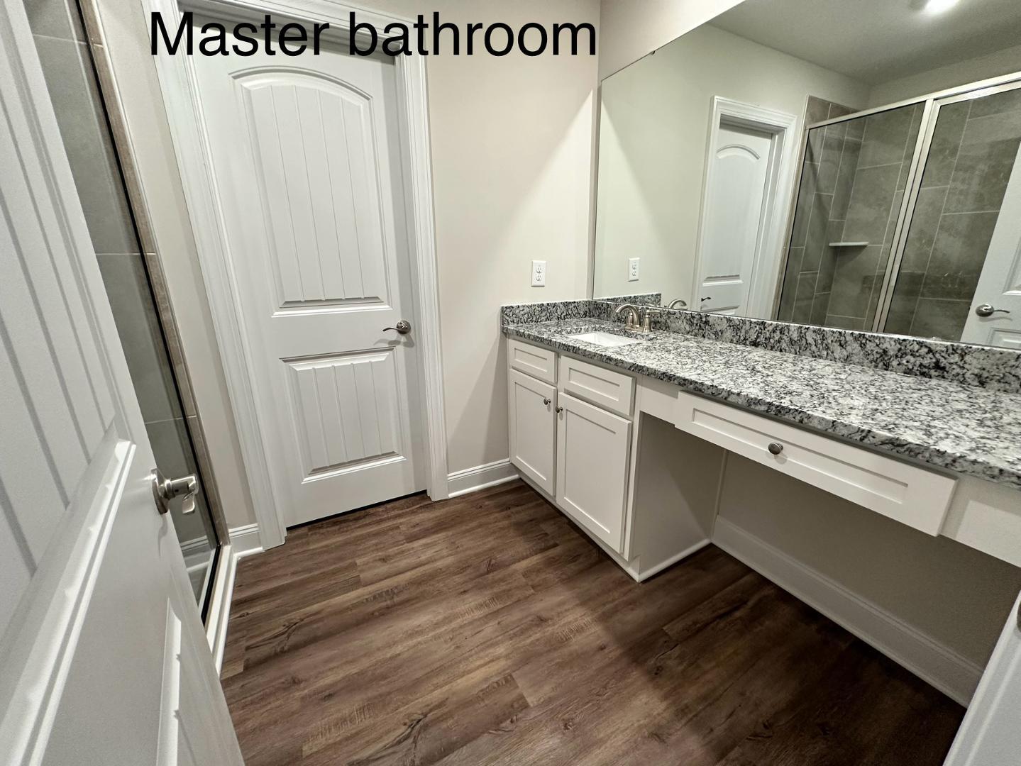 6931 Point Bar Place Raleigh, NC 27616 - Photo 5 of 13 a bathroom with a sink and mirror