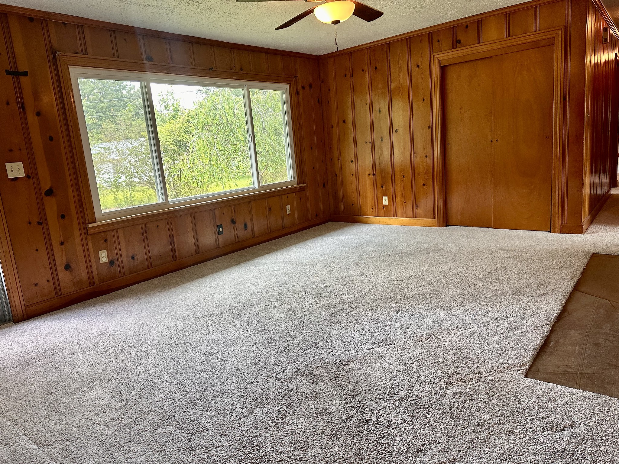 912 Hills Chapel Road Manchester, TN 37355 - Photo 8 of 23 a view of an empty room with a window and doors
