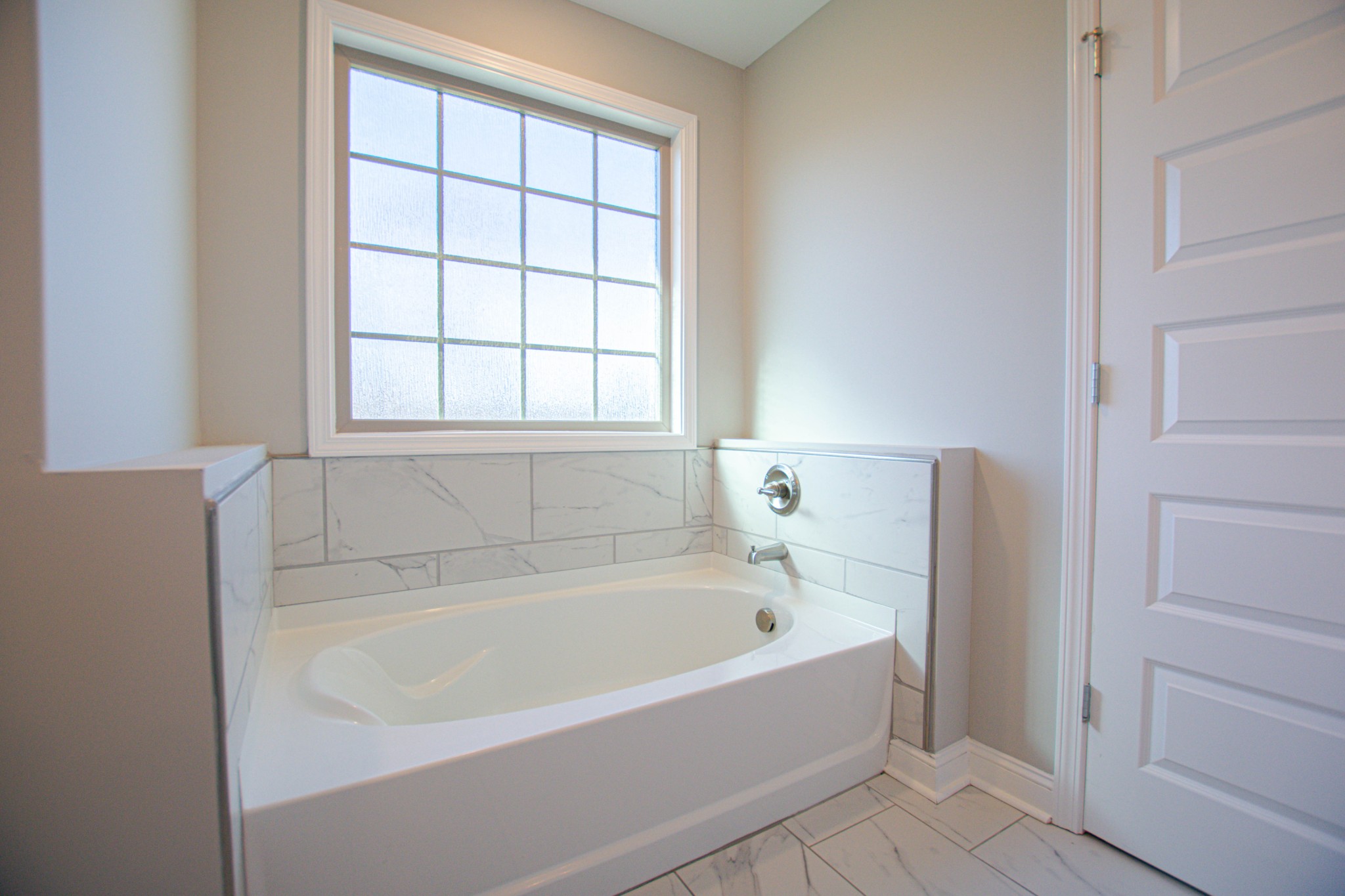 104 Schroer Road Clarksville, TN 37042 - Photo 17 of 25 a white bath tub sitting next to a window