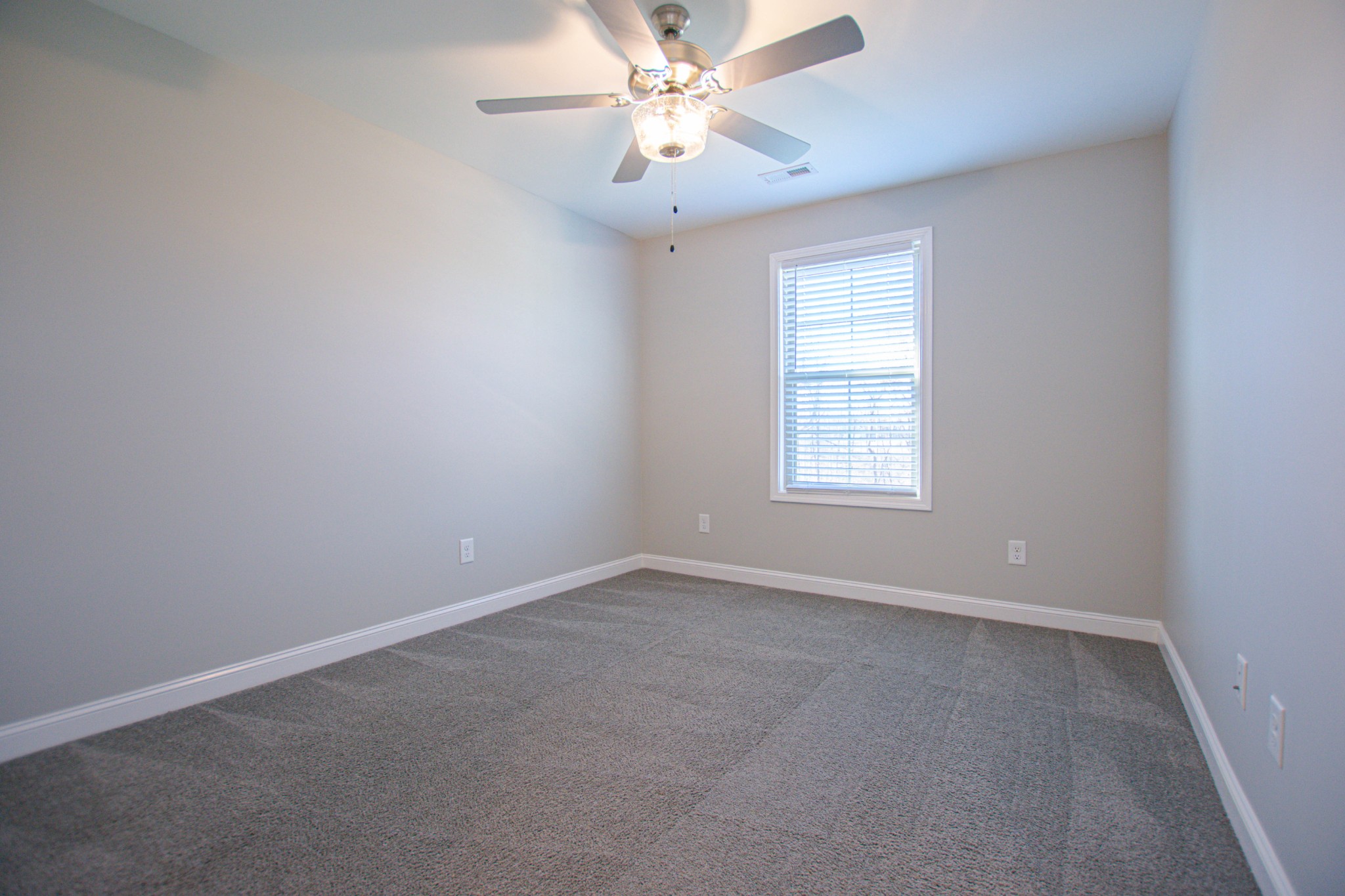 104 Schroer Road Clarksville, TN 37042 - Photo 19 of 25 an empty room with windows and fan