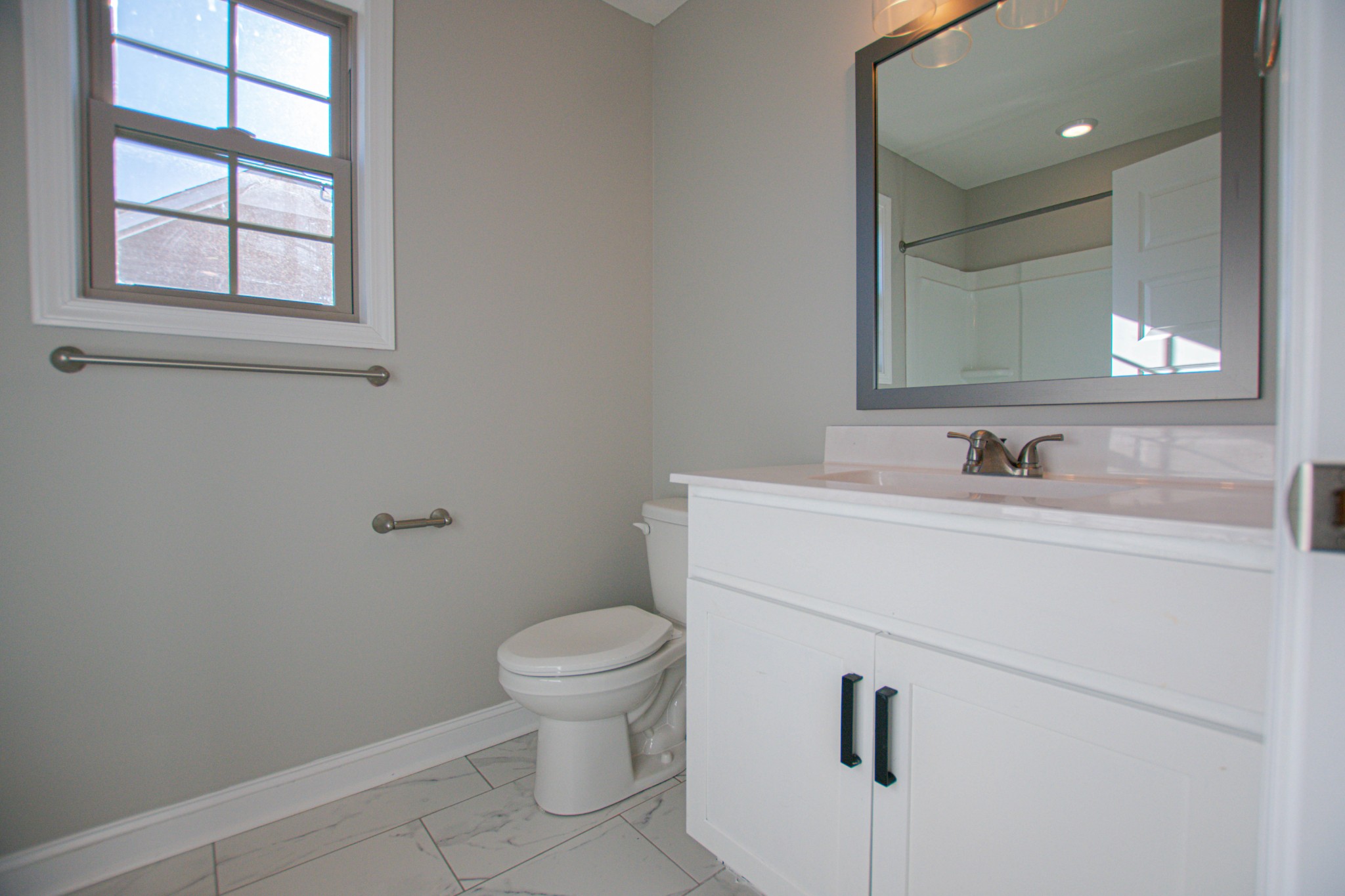 104 Schroer Road Clarksville, TN 37042 - Photo 20 of 25 a bathroom with a sink toilet and vanity