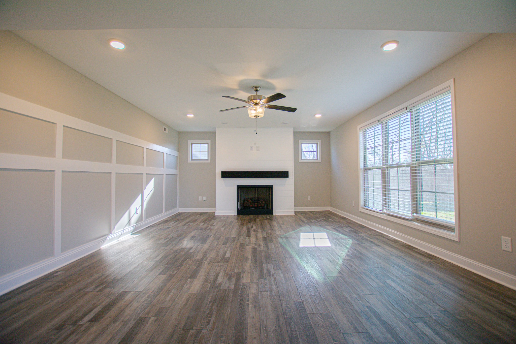 104 Schroer Road Clarksville, TN 37042 - Photo 2 of 25 a view of an empty room with wooden floor fireplace and a window