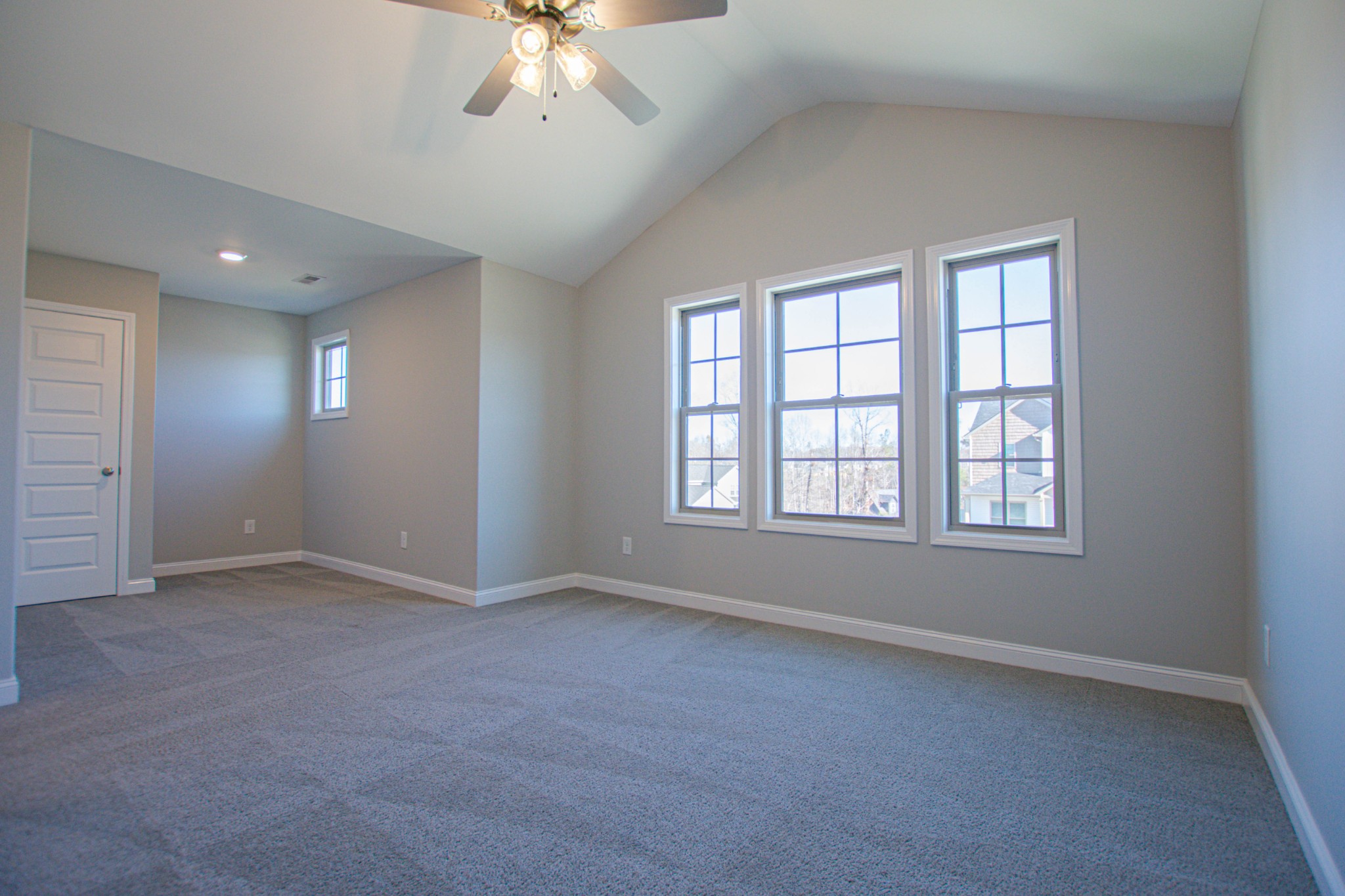104 Schroer Road Clarksville, TN 37042 - Photo 23 of 25 an empty room with chandelier fan and windows
