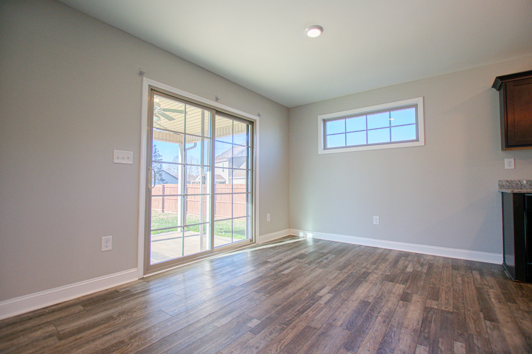 104 Schroer Road Clarksville, TN 37042 - Photo 6 of 25 a view of an empty room with wooden floor and a window