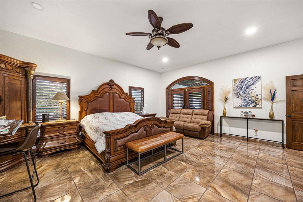 41 Graham Lane Lucas, TX 75002 - Photo 10 of 17 a bedroom with a bed and wooden floor