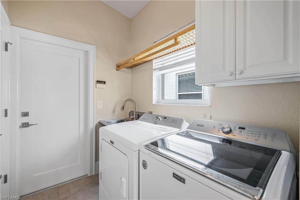 17945 Modena Road Miromar Lakes, FL 33913 - Photo 18 of 24 a utility room with dryer and washer