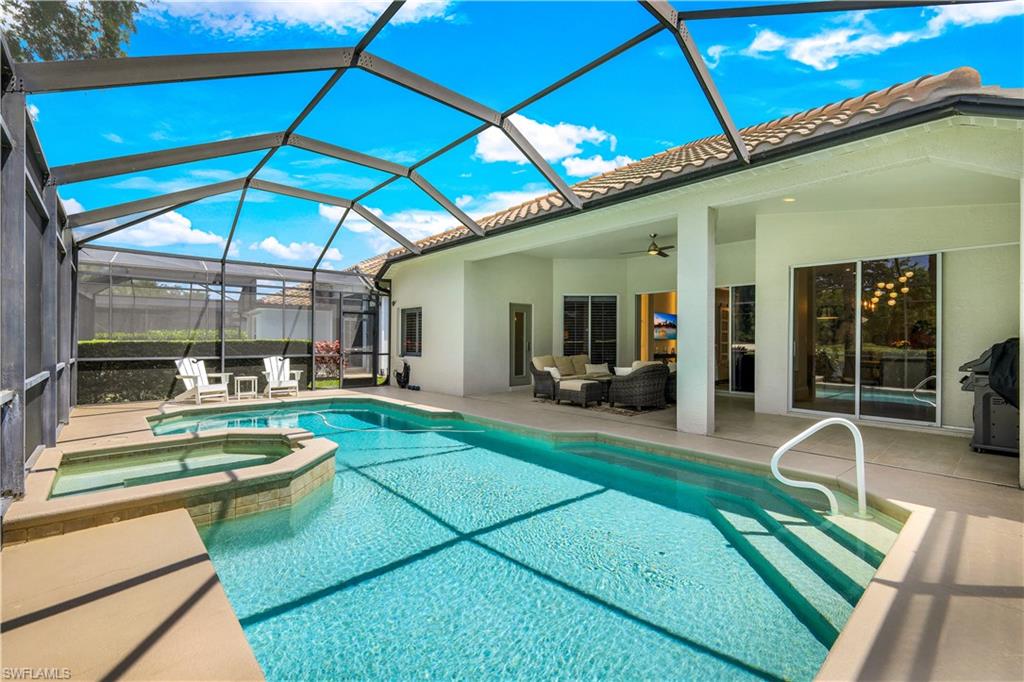 17945 Modena Road Miromar Lakes, FL 33913 - Photo 21 of 24 a view of a backyard with swimming pool and furniture