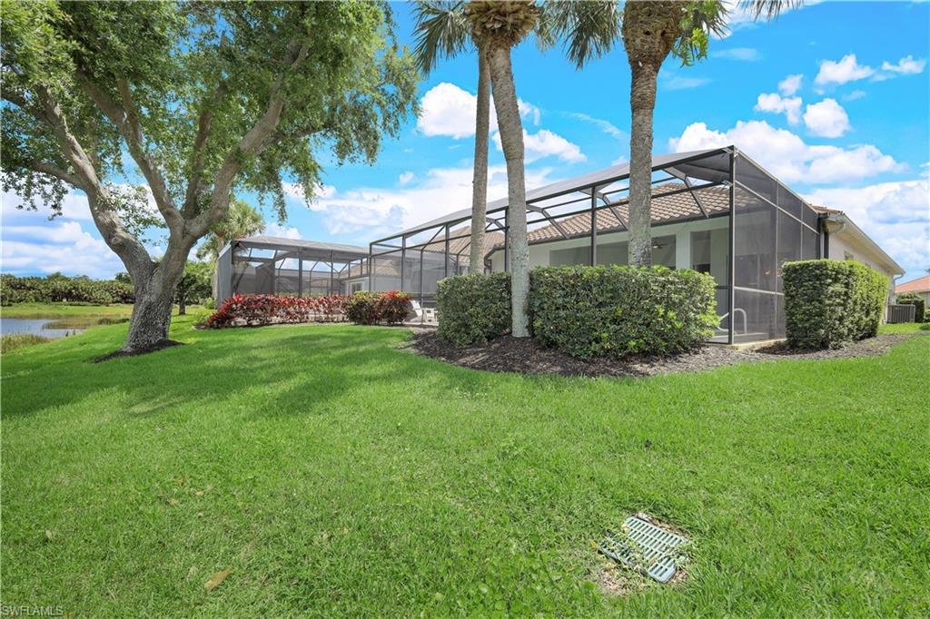 17945 Modena Road Miromar Lakes, FL 33913 - Photo 24 of 24 a front view of a house with garden