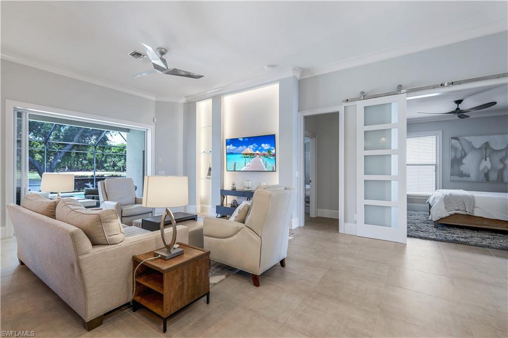 17945 Modena Road Miromar Lakes, FL 33913 - Photo 3 of 24 a living room with furniture and a large window